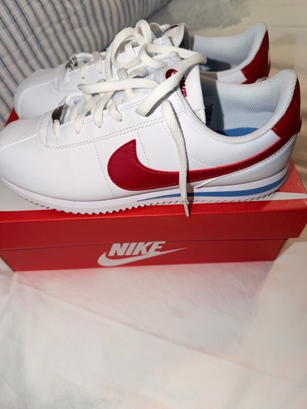 Nike Kids White Sneakers with Red Swoosh